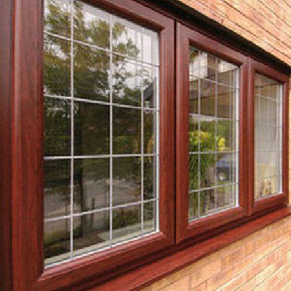 A close up of a window on a brick wall.