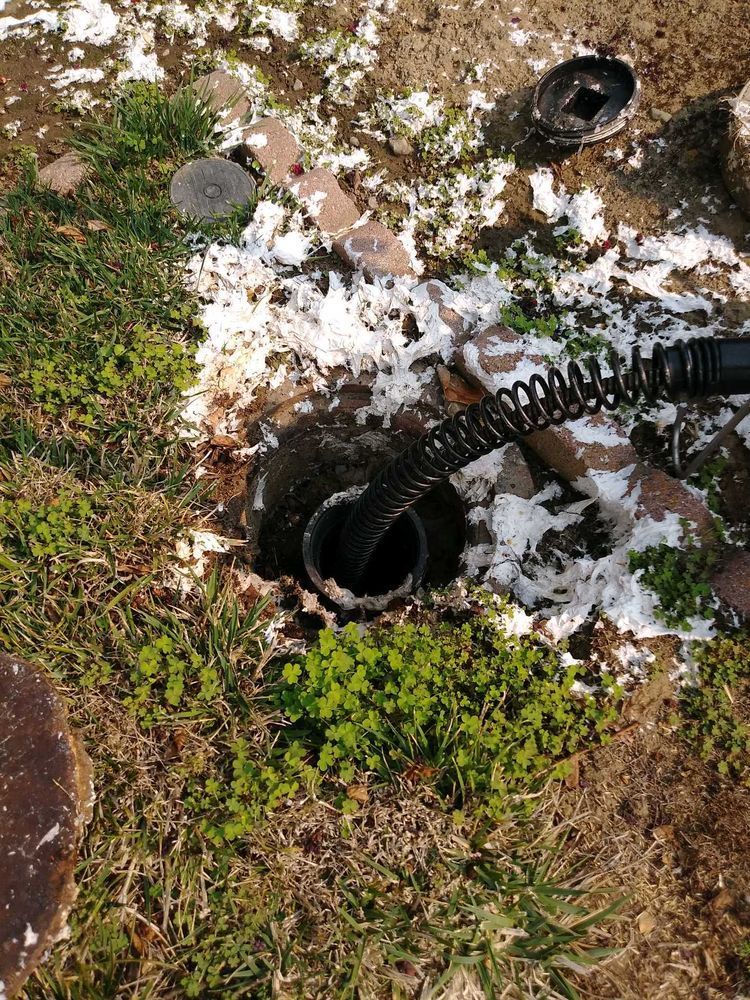 A bunch of junk is laying on the ground in the grass.