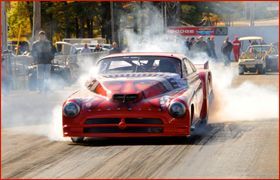 A red race car with the number 15 on it