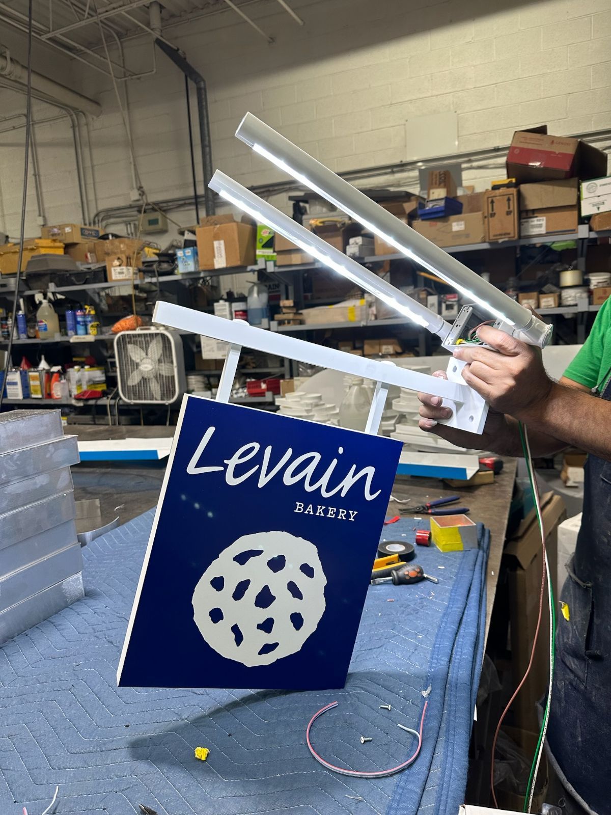 Person installing a sign with