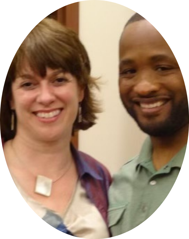 A man and a woman are posing for a picture and smiling