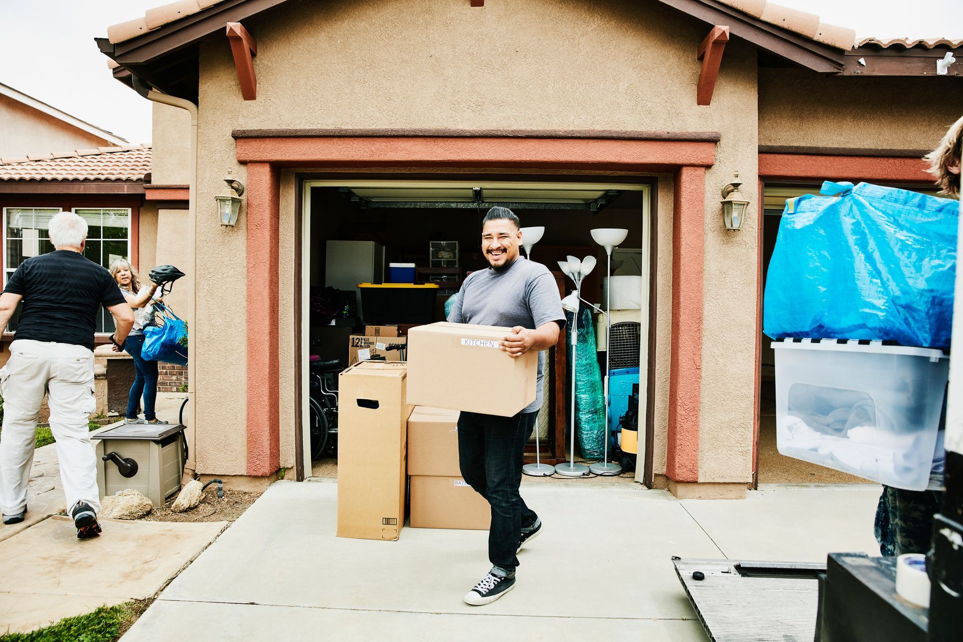 Man Carrying Box Into New Home | Wilmington, DE | A to B Moving Service