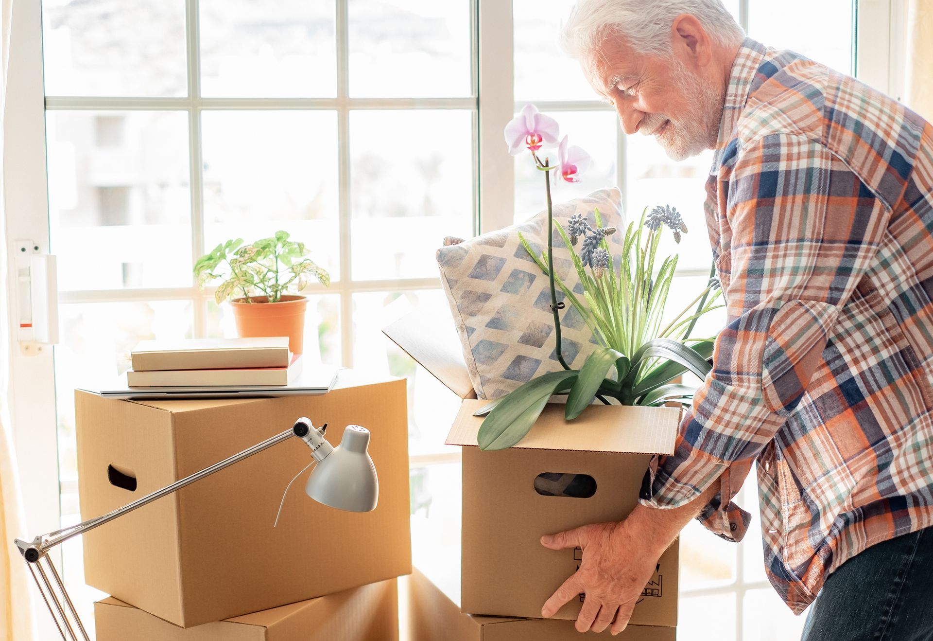 Senior Man Holding A Box | Wilmington, DE | A to B Moving Service
