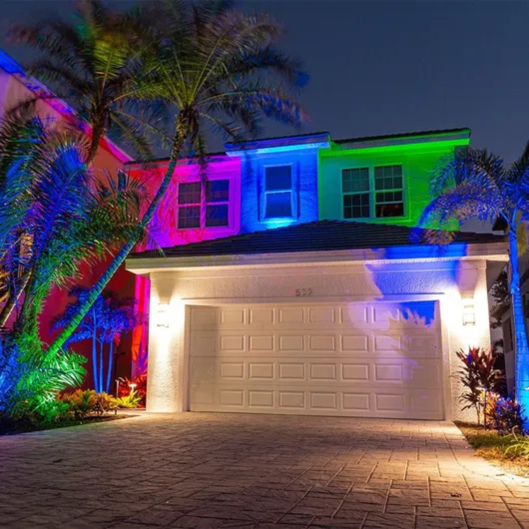 Photo of a  home in Florida with colorful exterior lighting shining on it