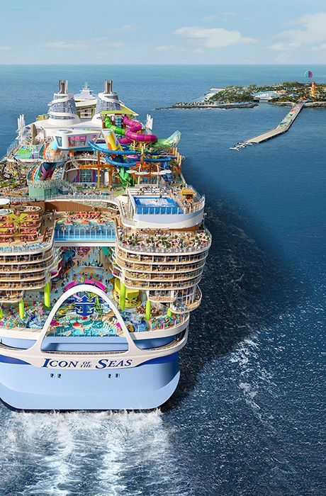 A large cruise ship sailing through clear Caribbean waters.