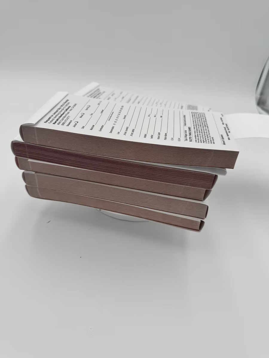 A stack of matches sitting on top of each other on a table.