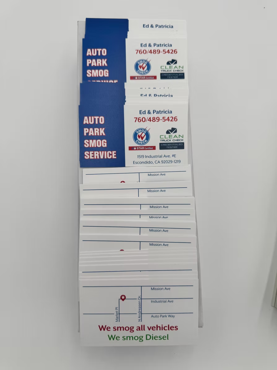 A sign that says auto park smog service on it