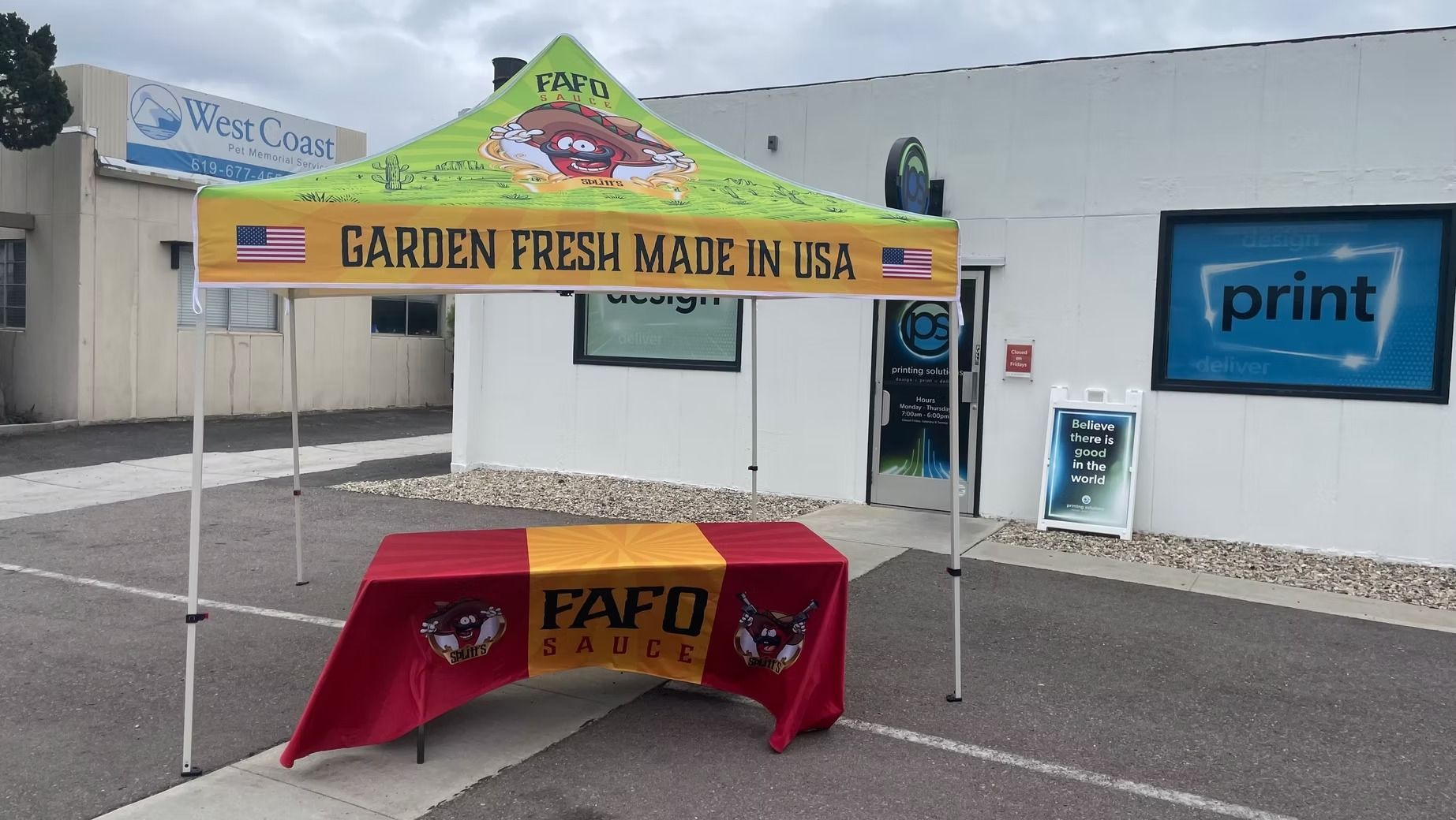 A table under a tent that says garden fresh made in usa