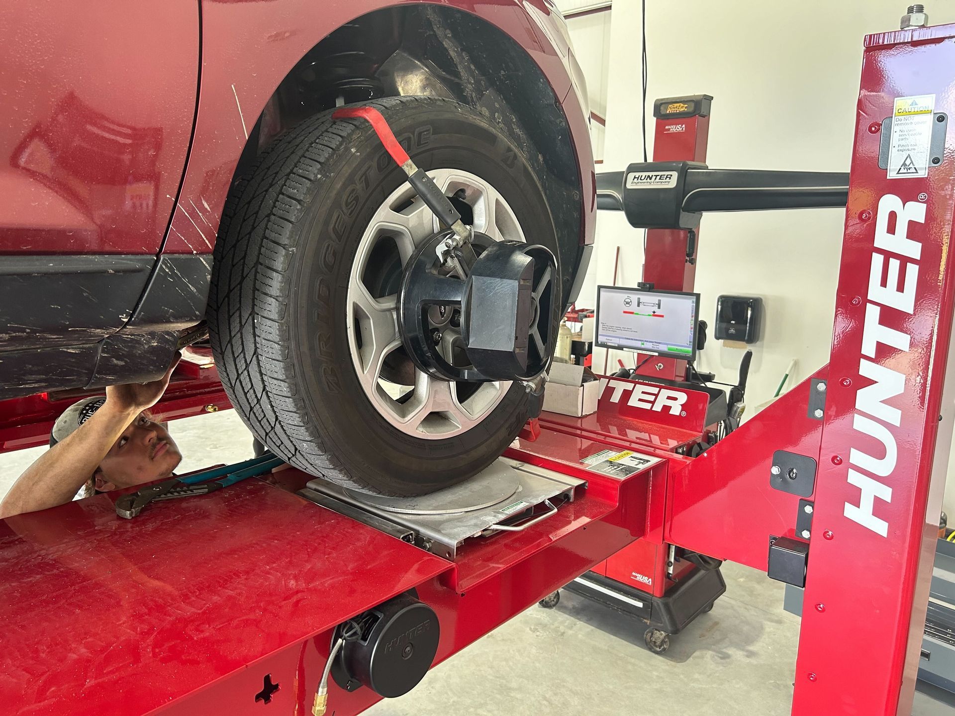 Auto DR's certified mechanic working on a car from a Lenox Township resident. 