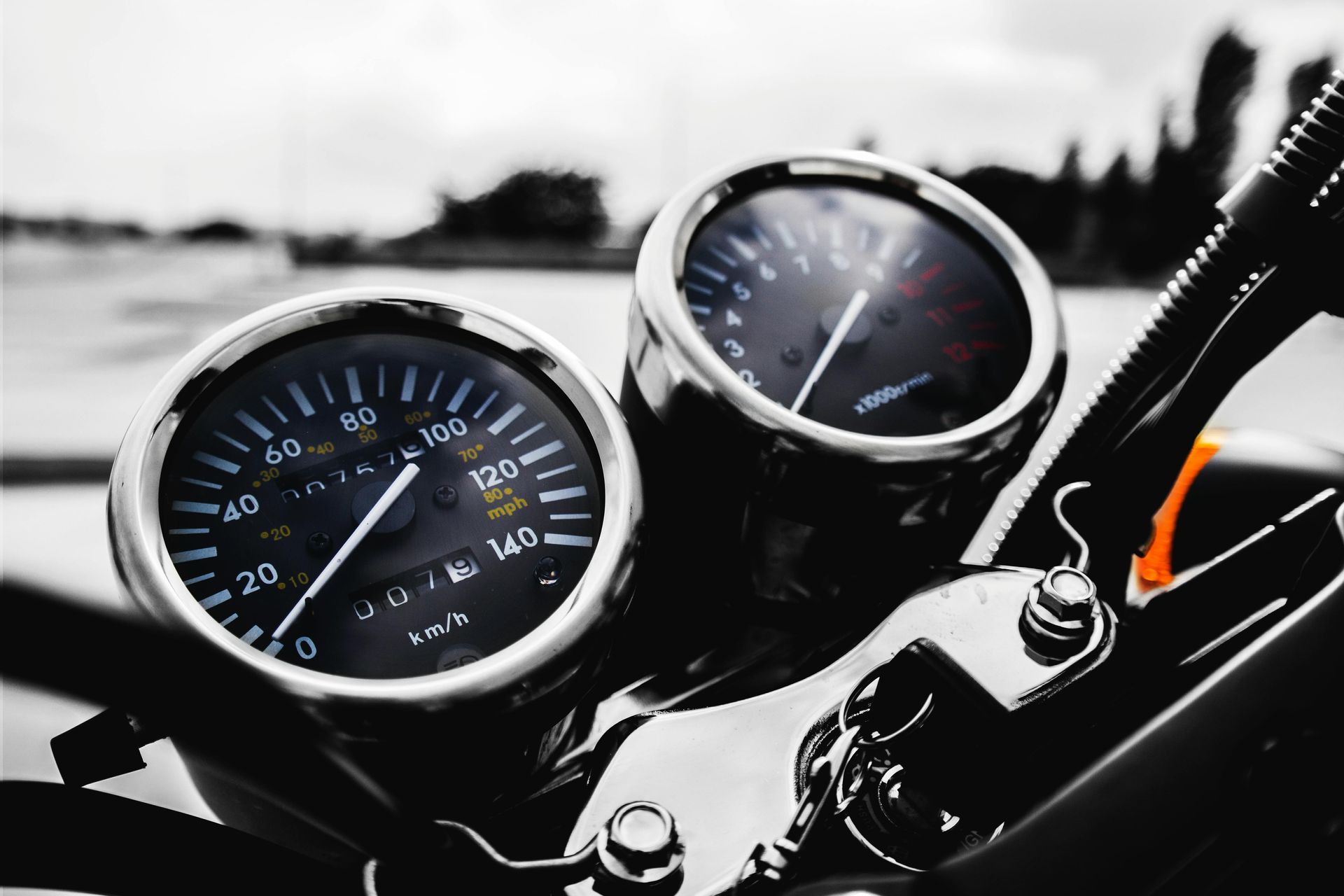A speedometer reads 0 miles per hour. A gauge shows revolutions per minute next to it. 