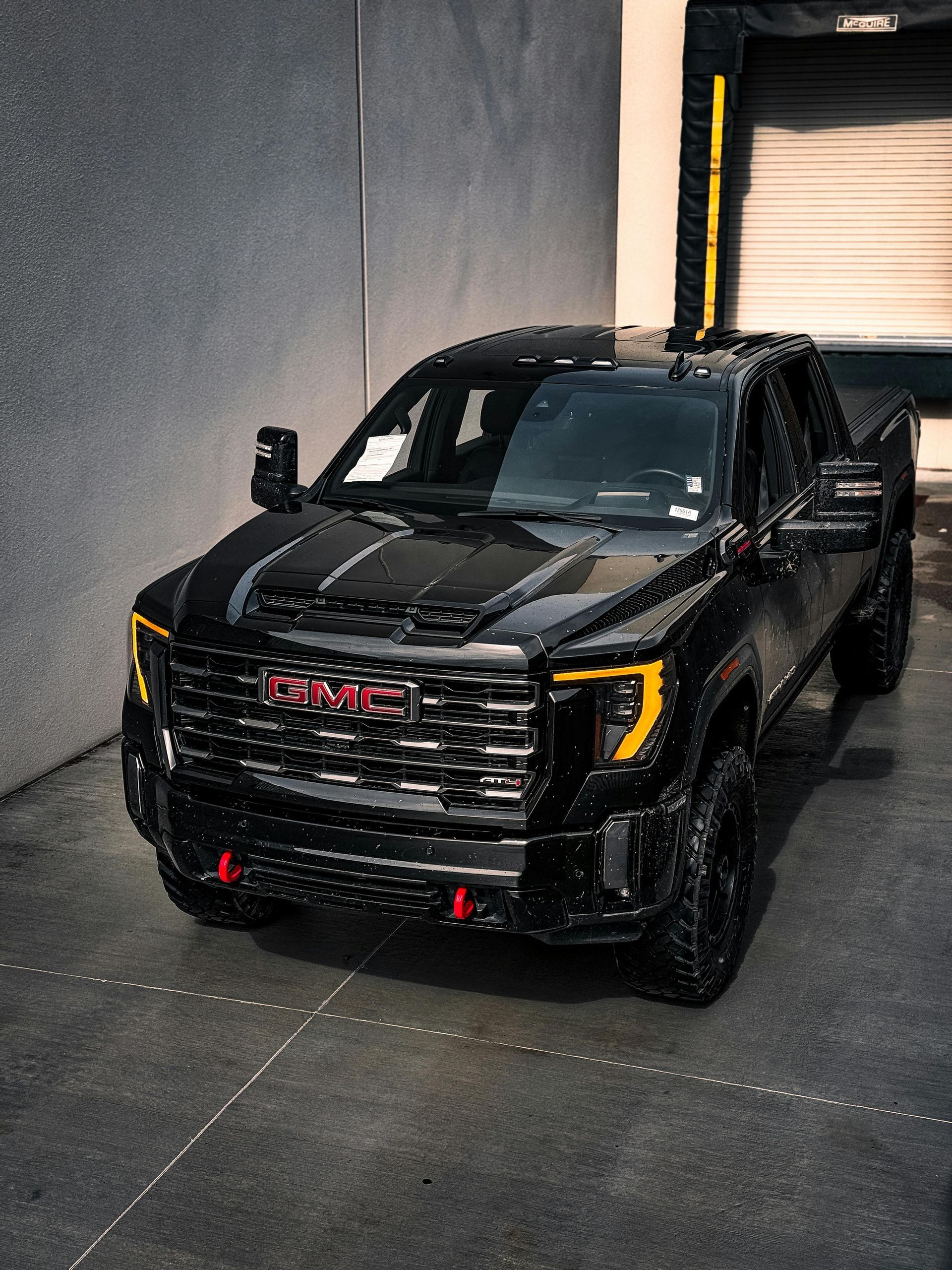 A  black GMC truck pulls out of a garage in Macomb County. 