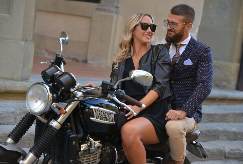 a couple on a motorcycle