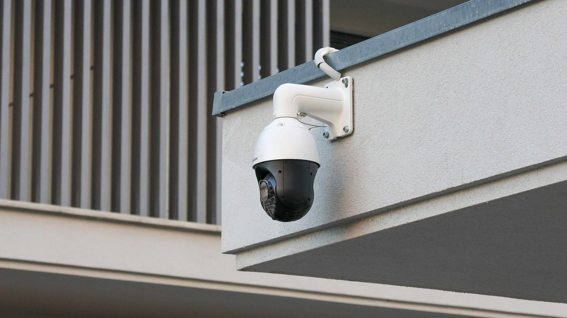 Security camera mounted on a building's exterior.