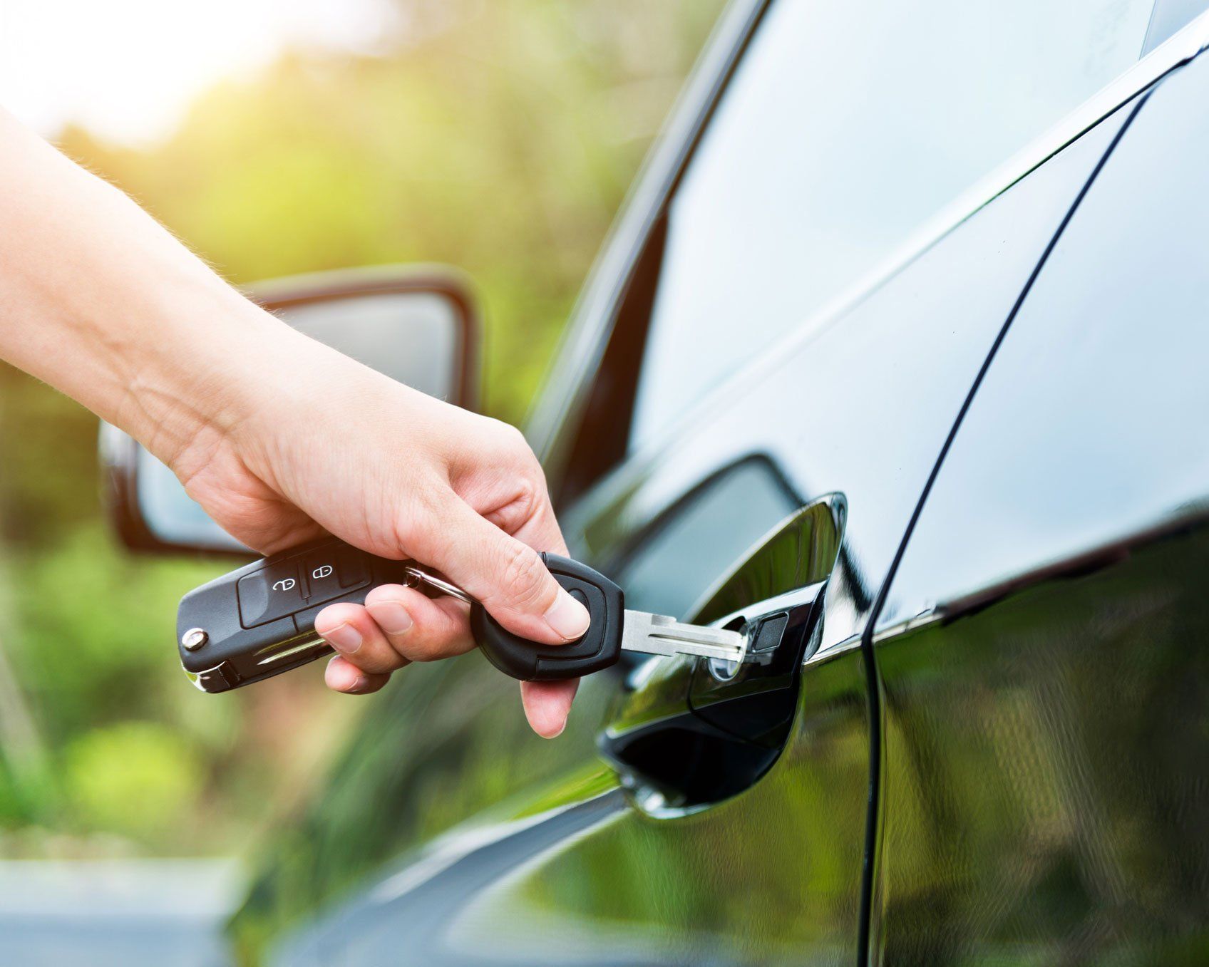 Inserting Key In Car Door — Topeka, KS — Lockworks
