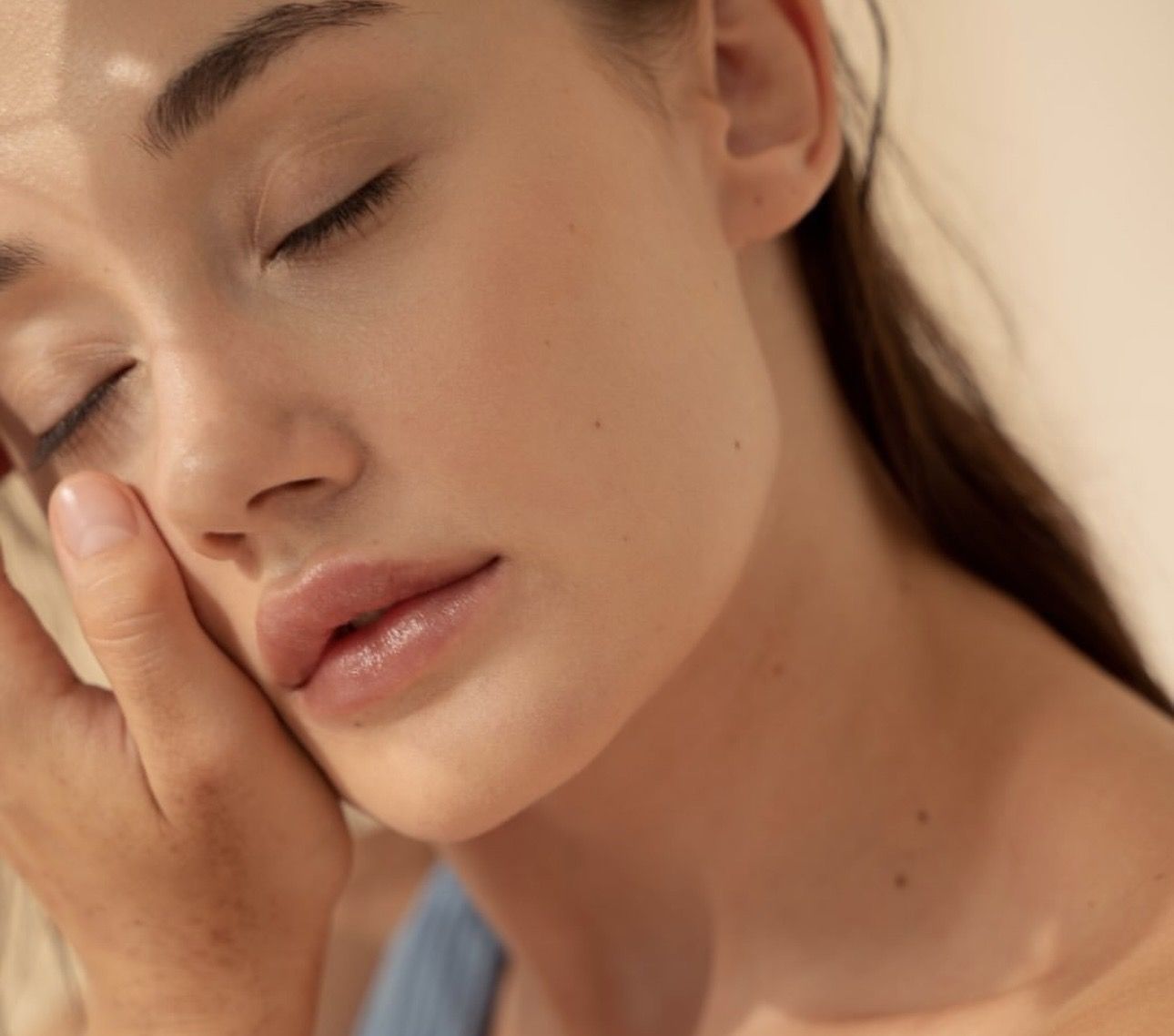 A close up of a woman 's face with her mouth open.