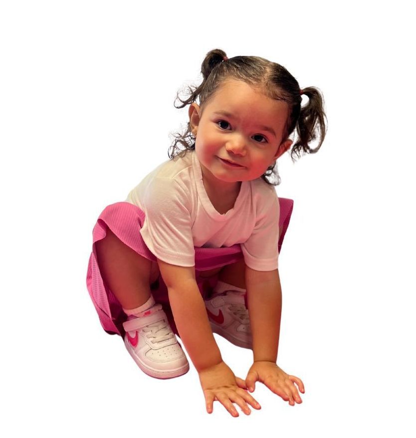 a young athlete is sitting and stretching