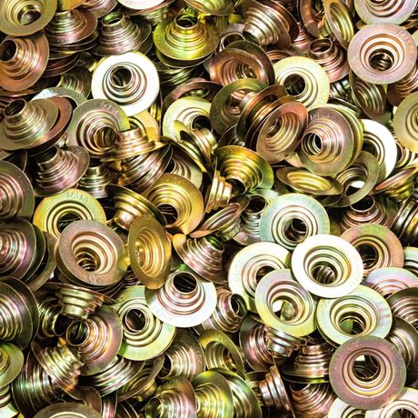 A heap of metal screws and washers, commonly used in construction and assembly tasks.