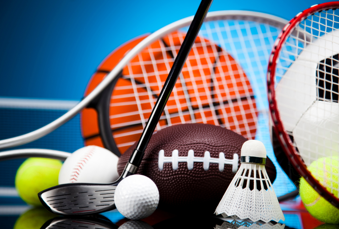 Assorted sports equipment including a basketball, football, tennis racket, and golf ball against a blue background.