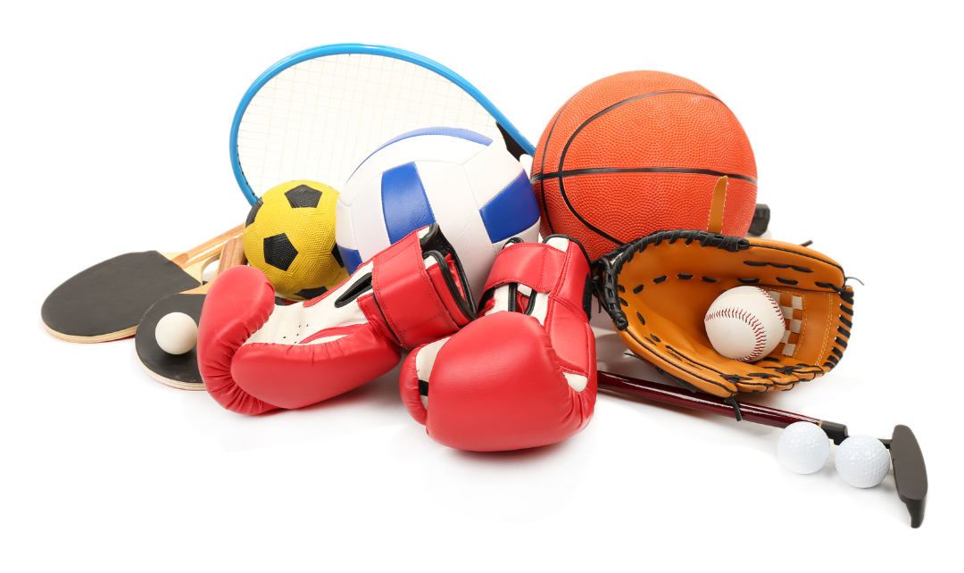Pile of sports equipment, including balls, rackets, gloves, and boxing gloves.