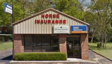 A group of business people are posing for a picture together