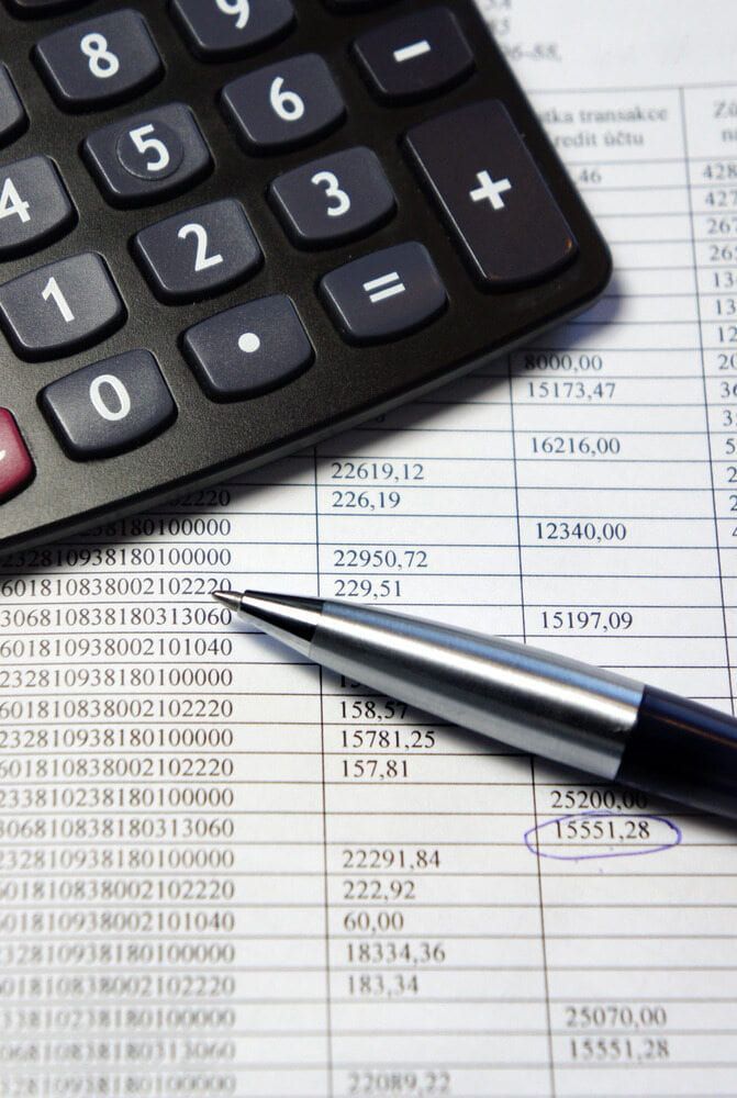 A Calculator And A Pen On Top Of A Sheet Of Paper — Visionary Accounting In Dubbo, NSW