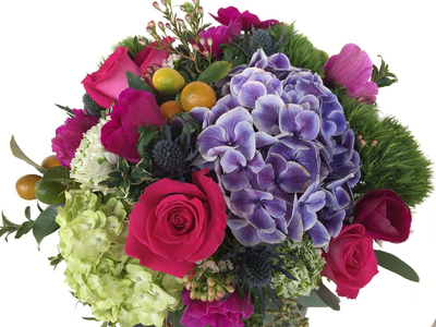 A close up of a bouquet of flowers on a white background