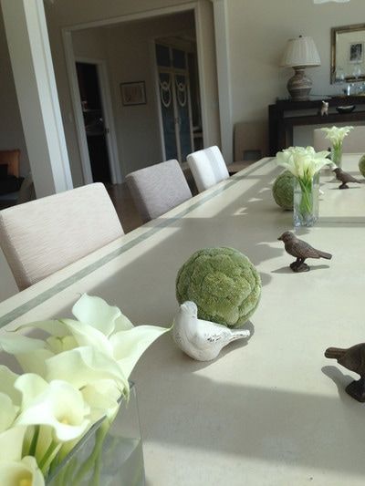 A table with flowers and birds on it