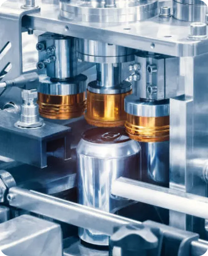 A machine is making aluminum cans in a factory