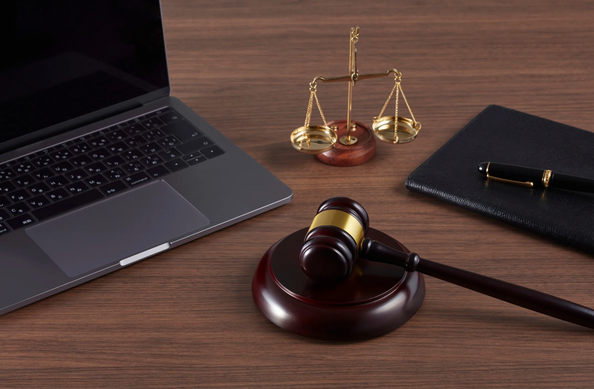 lawyers laptop and notebook with pen