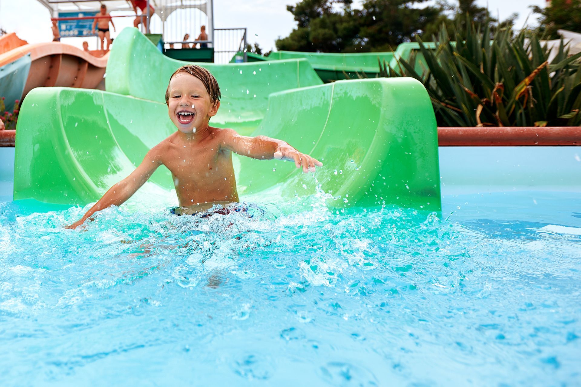 A cave filled with water and a wooden bridge.