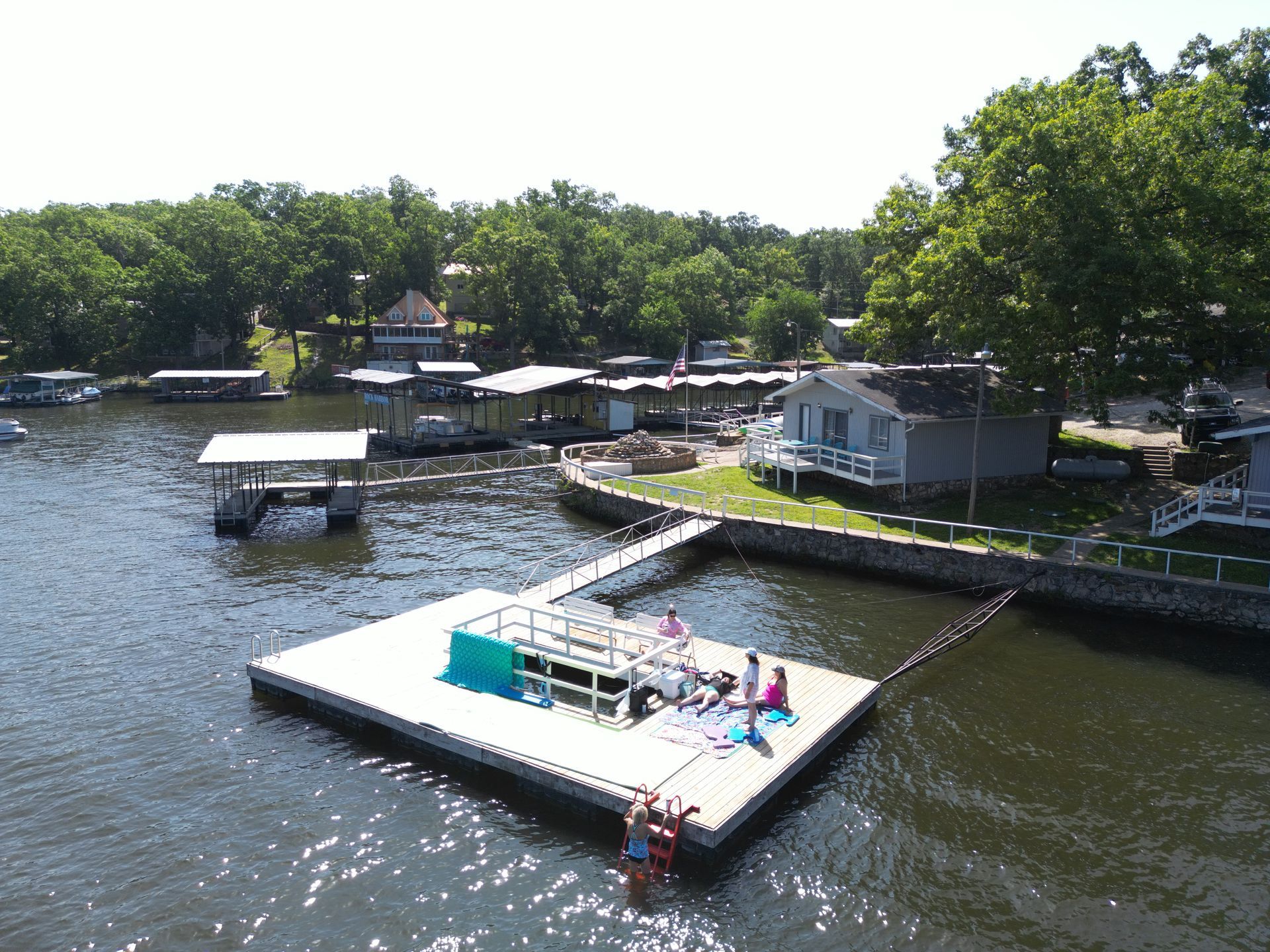 An aerial view of a dock in the middle of a lake.