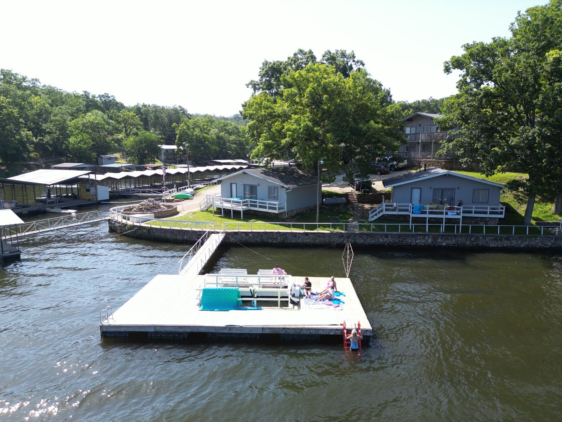 An aerial view of a dock in the middle of a lake