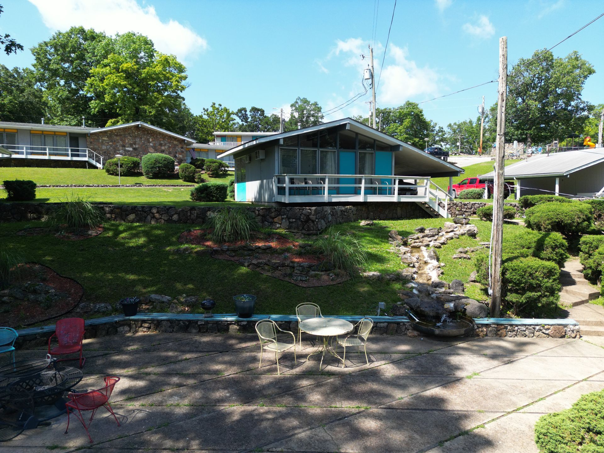 A house with a table and chairs in front of it
