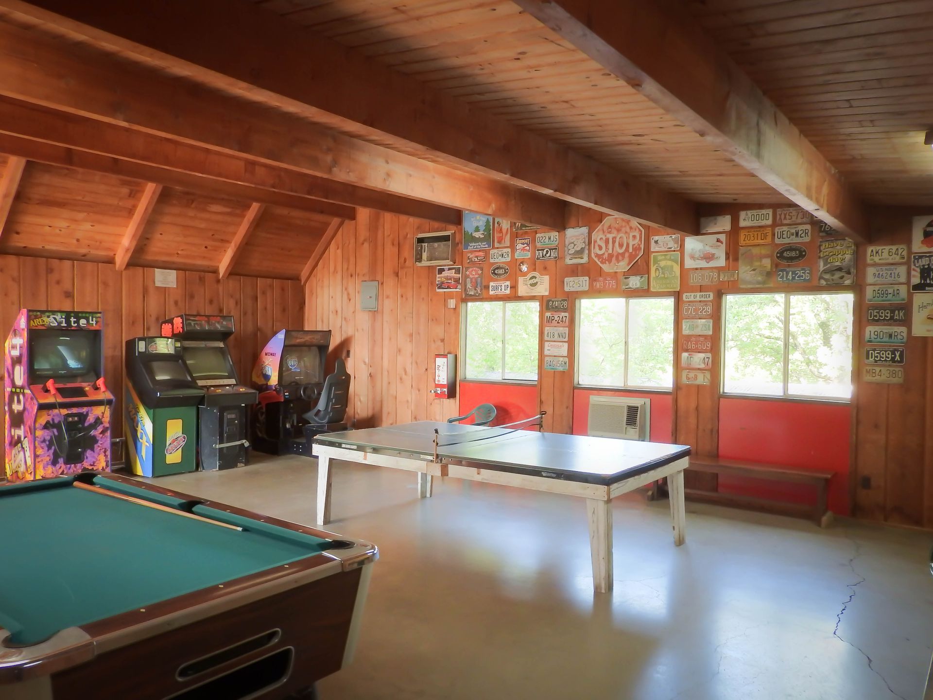 There is a pool table in the middle of the room.
