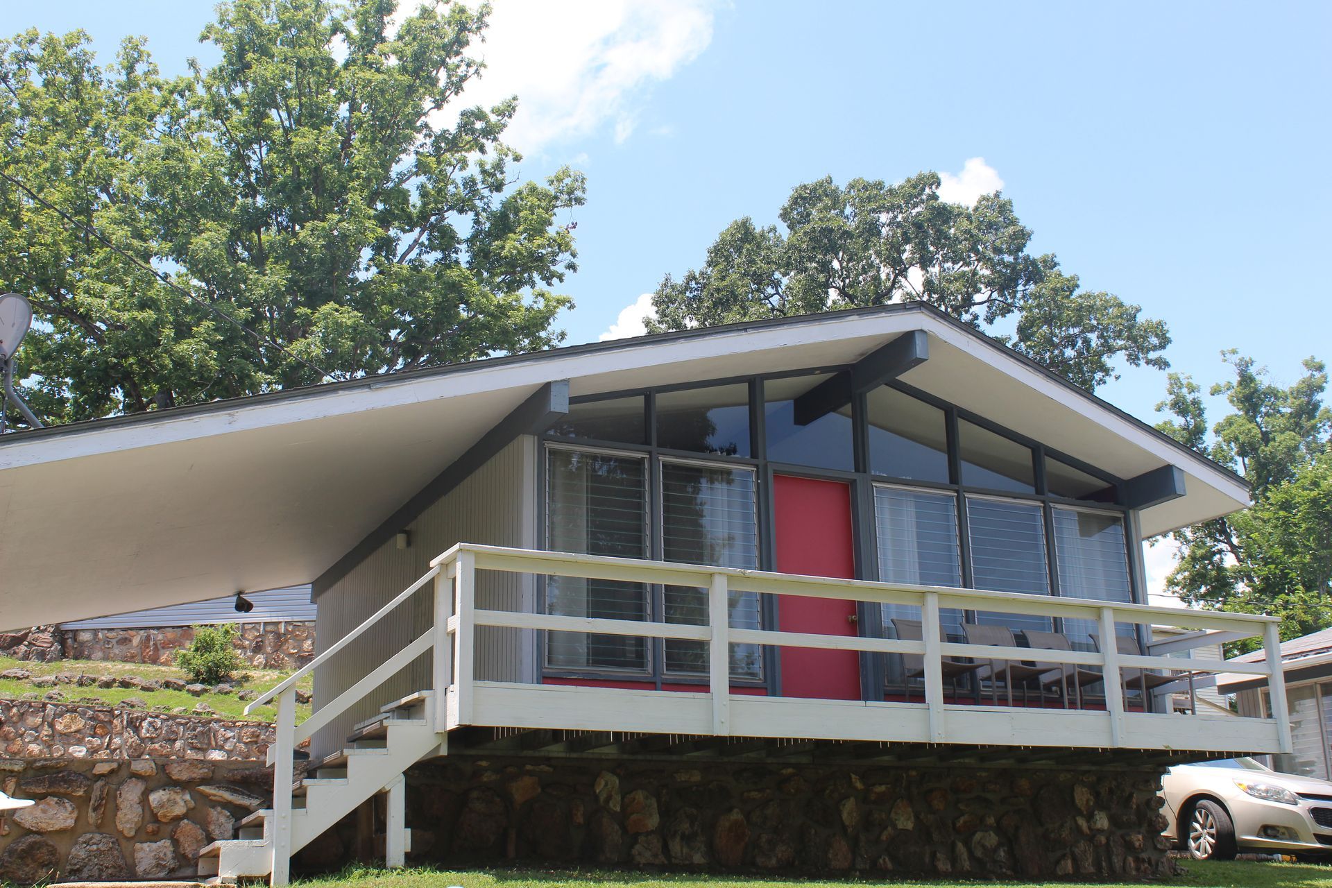 A house with a car parked in front of it