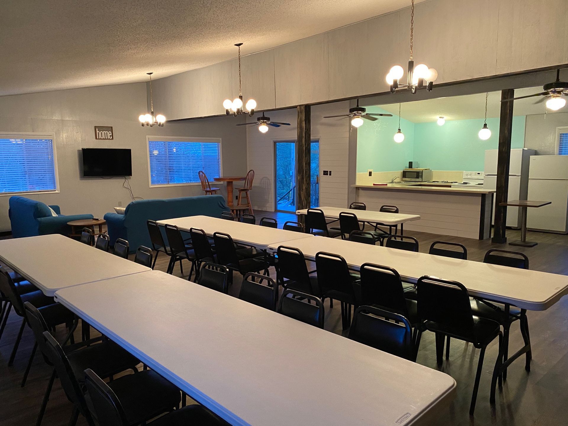 A large room with tables and chairs in it