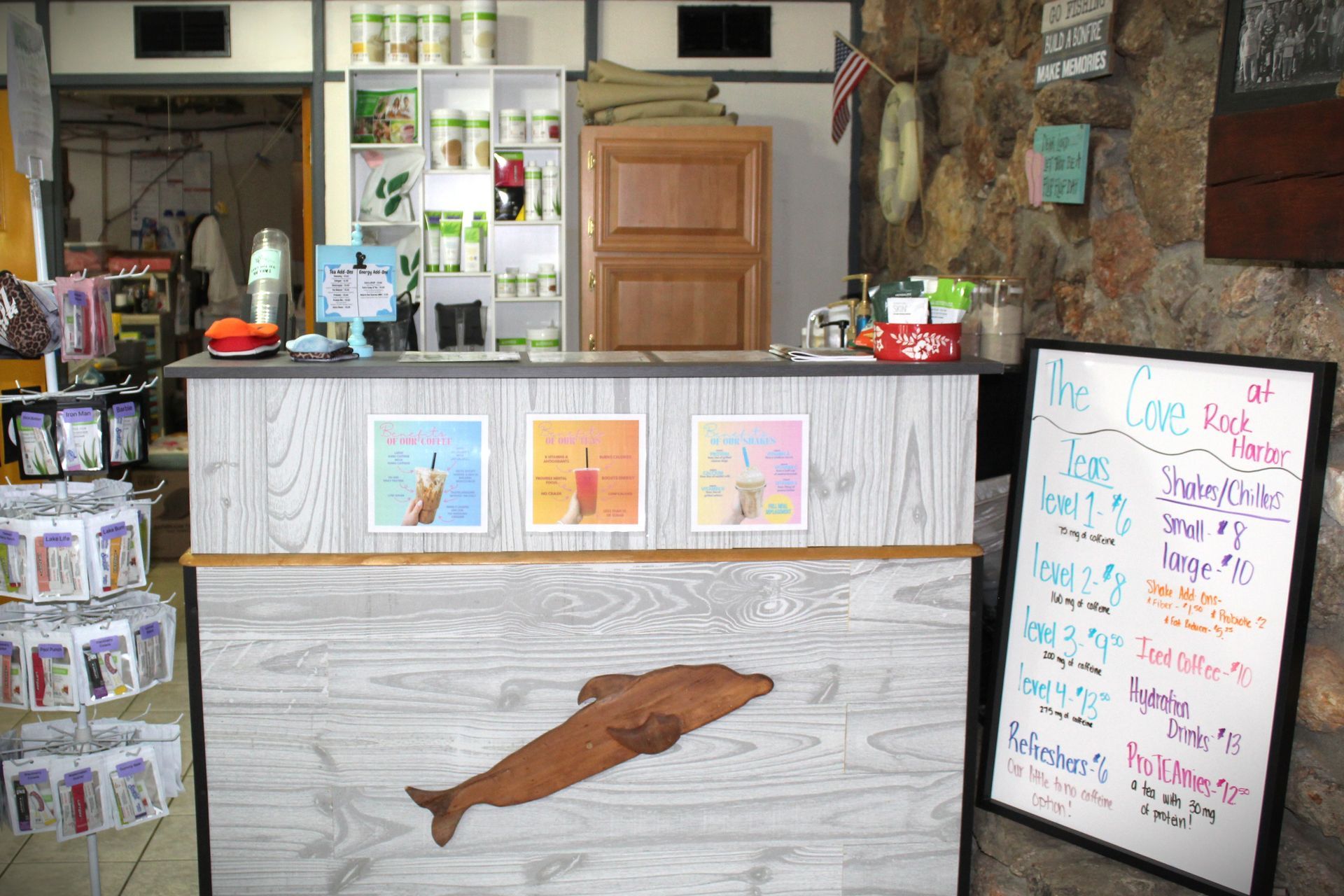 A dolphin is painted on a wooden counter in a store.