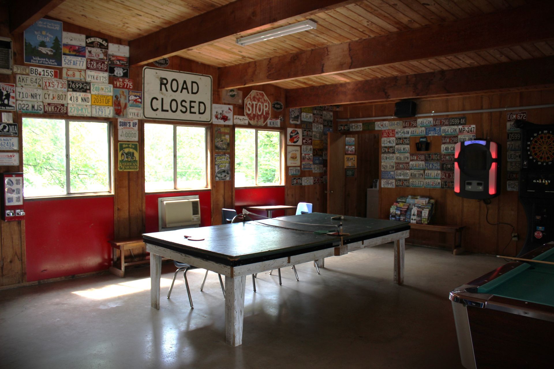 A room with a pool table and a sign that says road closed