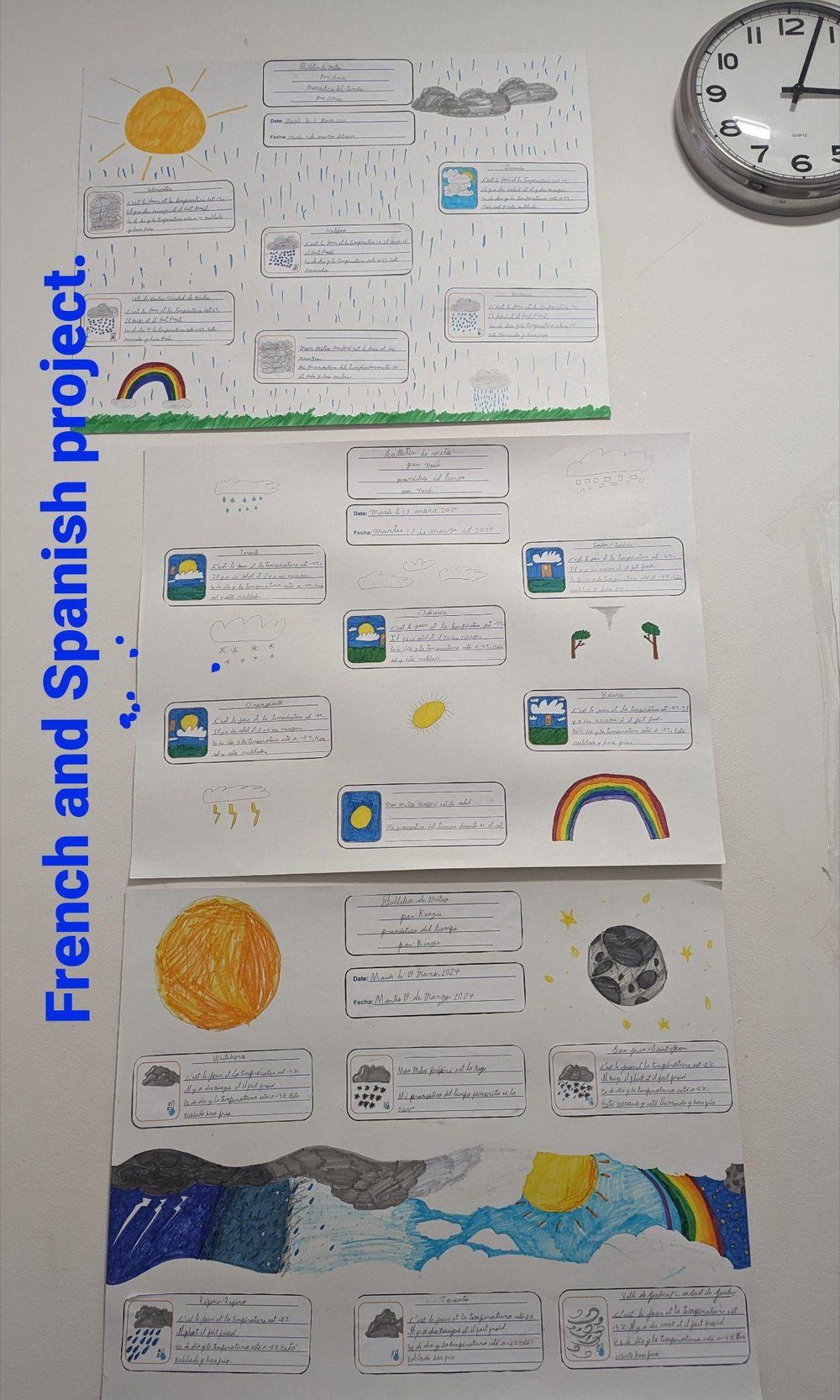 A french and spanish project is displayed on a wall