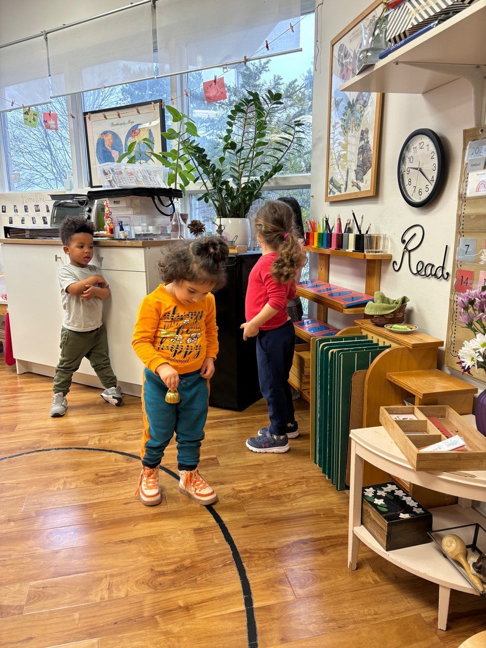 A group of children are playing in a classroom.