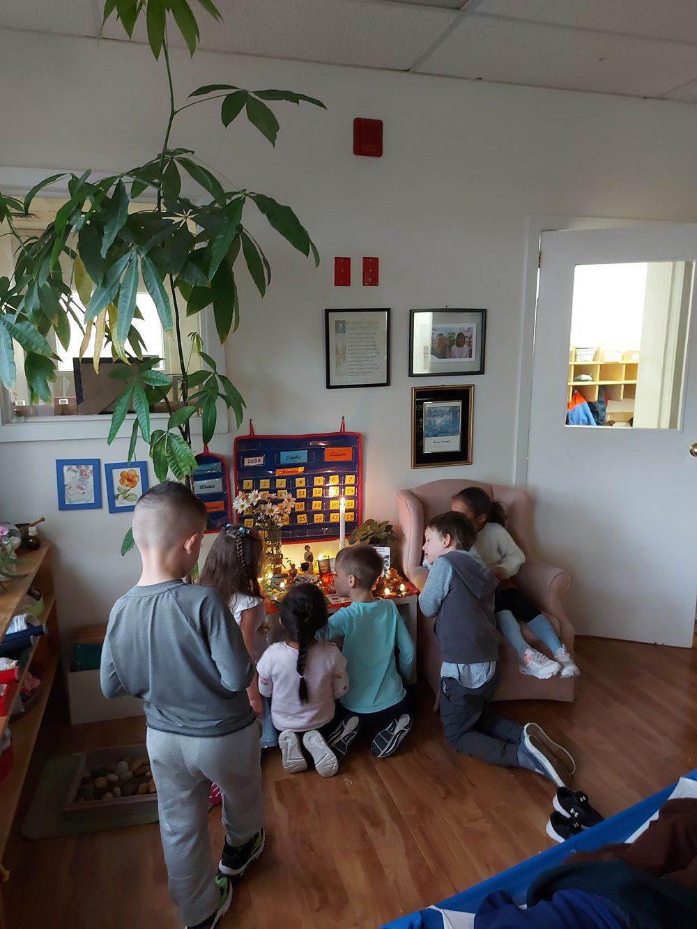 A group of children are playing in a living room
