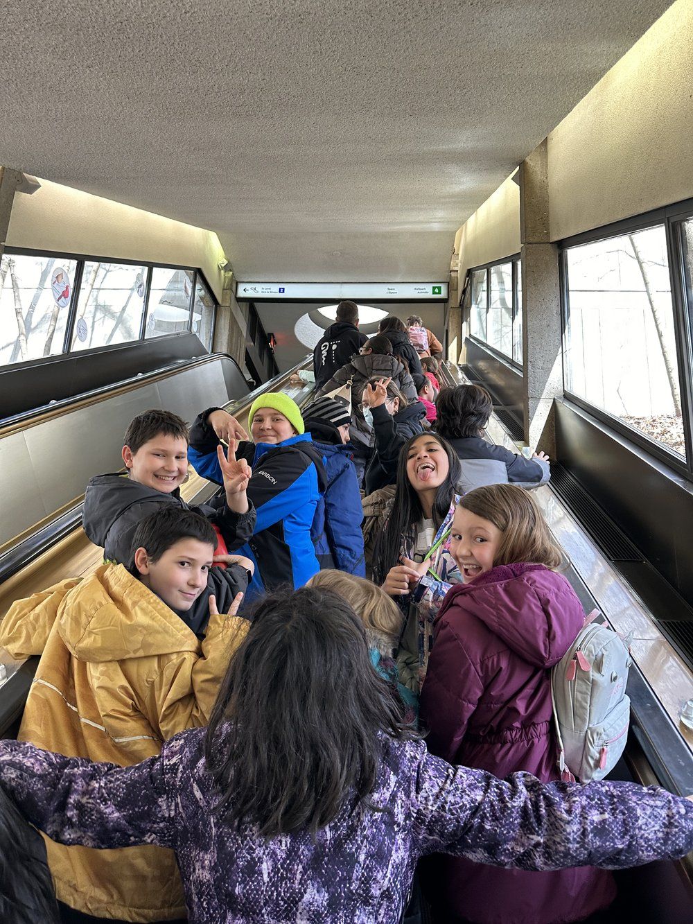 A group of children are sitting on a bus.