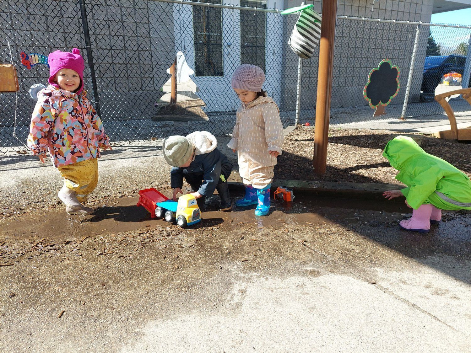 A group of children are playing in the mud.