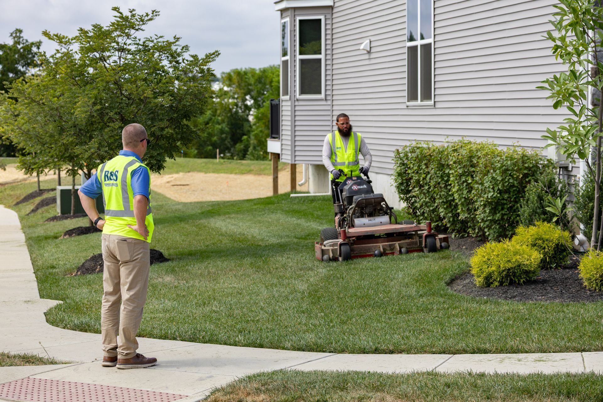 Male landscaper trimming bushes in Montgomery County, PA | R & S Property Services