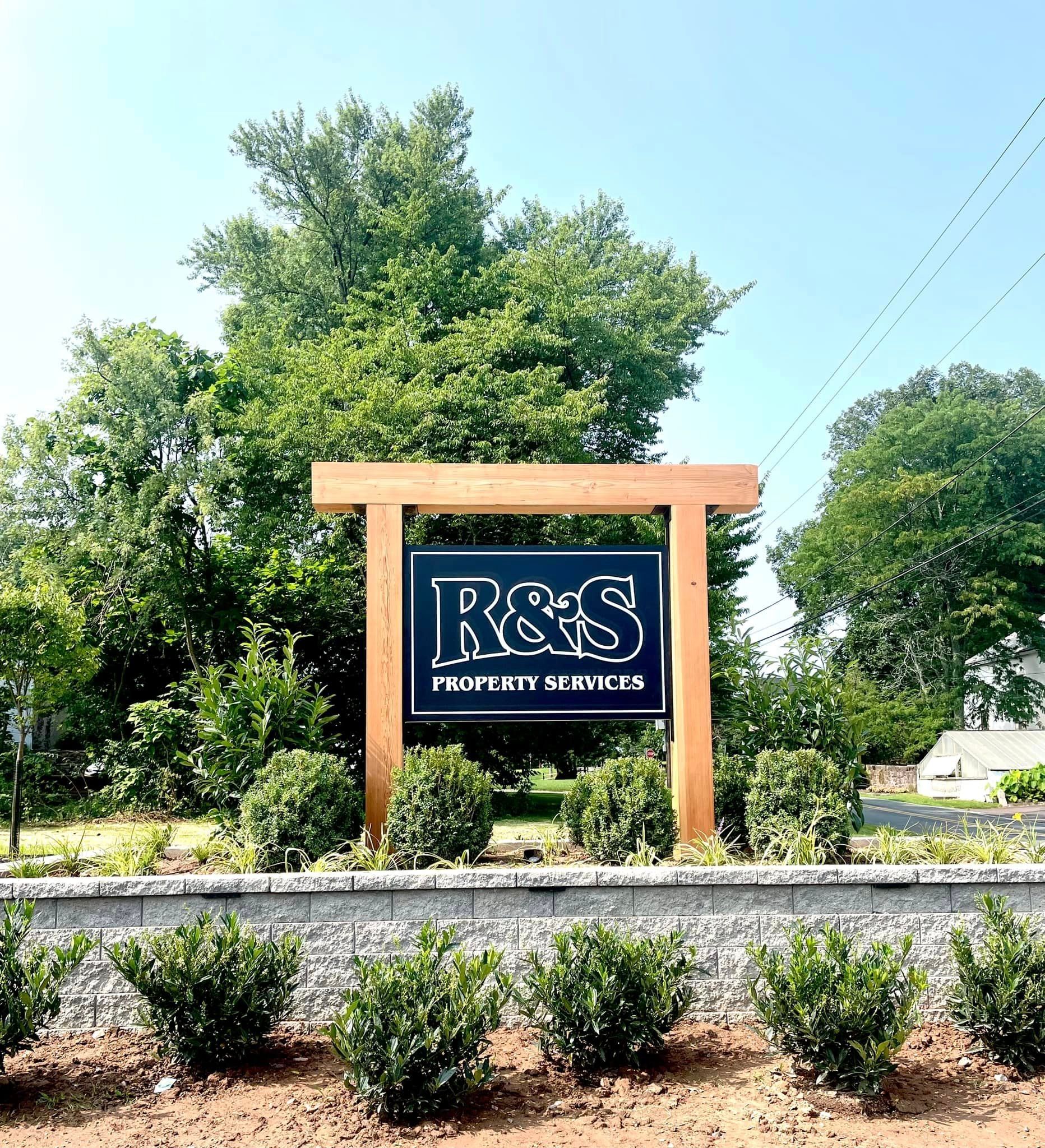R&S Property Services sign at the entrance to their main office