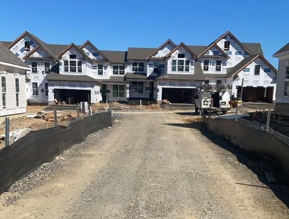 silt fences surrounding a road on a construction site