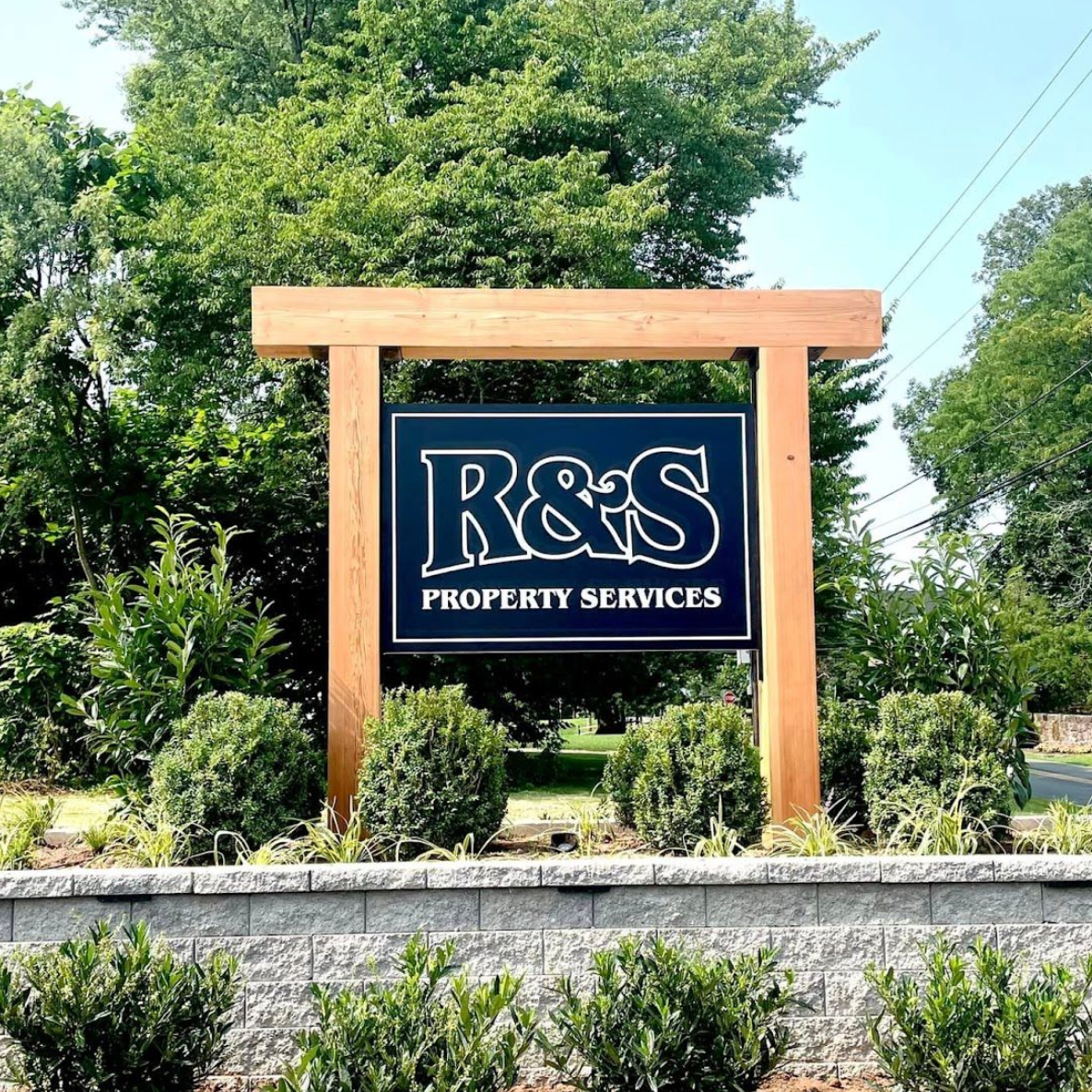 R&S Property Services Business Sign with Landscaped Background