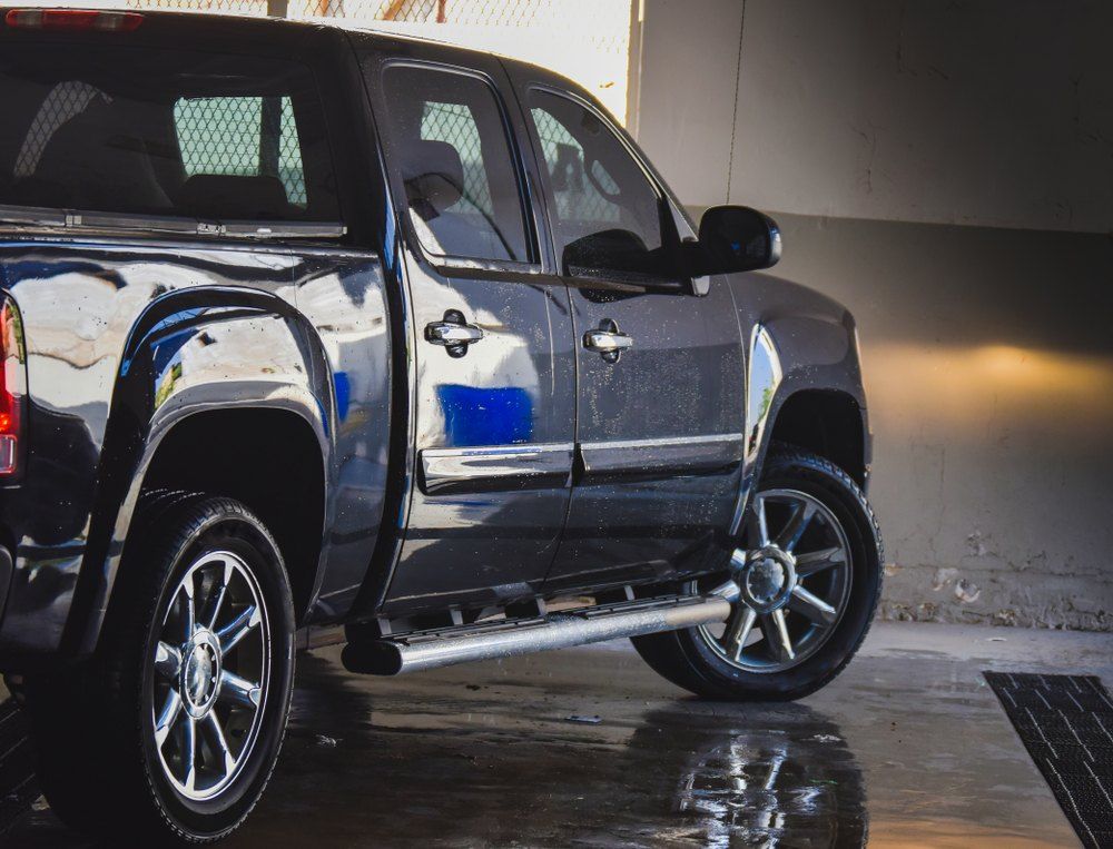 A Black Pickup Truck is Parked in a Garage — CS Mechanical in Gormans Hill, NSW