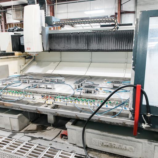 A Machine in A Factory with A Hose Attached to It - Buford, GA - EGM Tempering