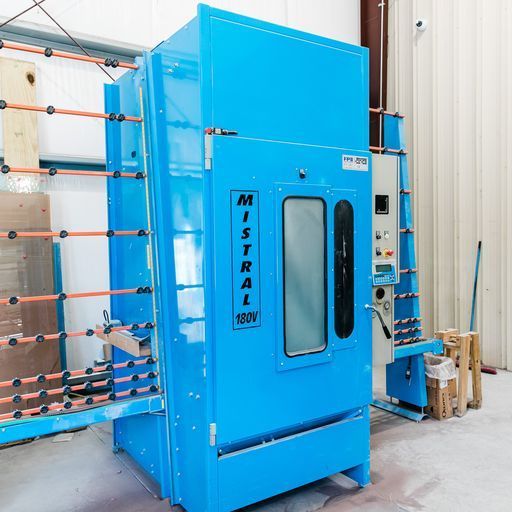 A Blue Mistral Machine Is Sitting in A Room - Buford, GA - EGM Tempering